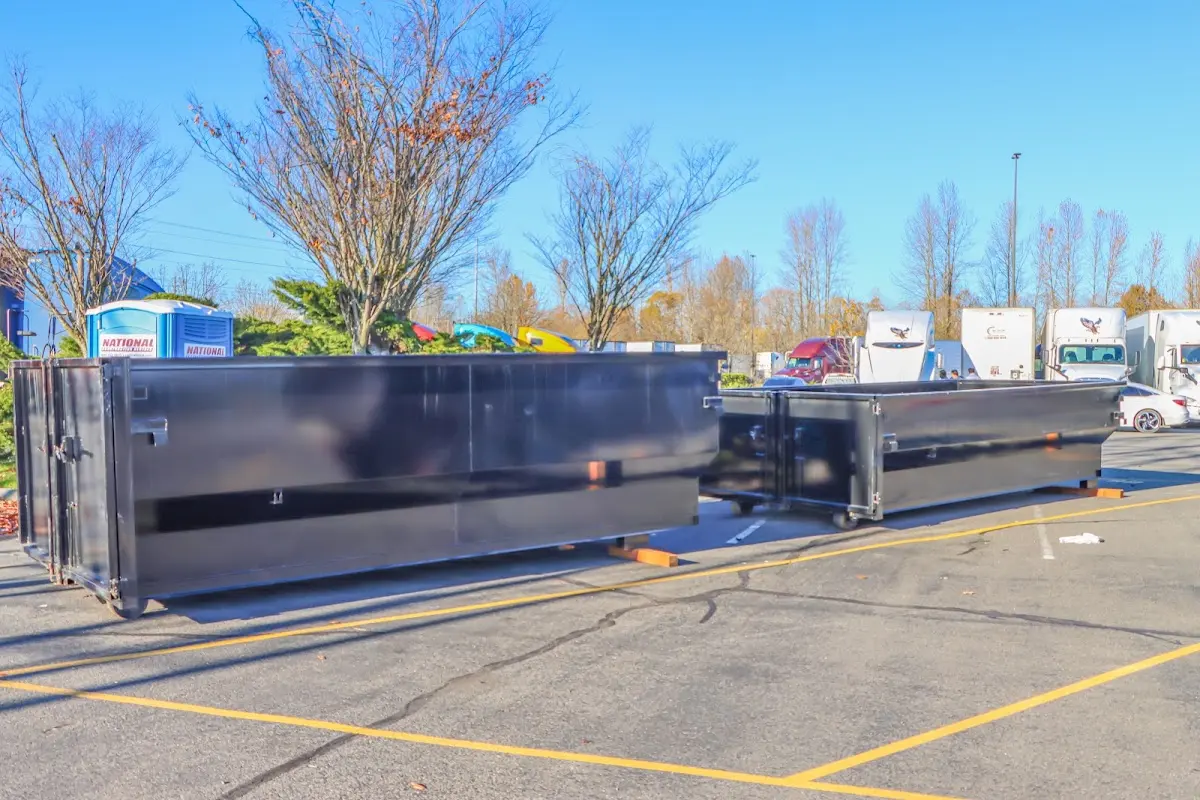 Professional dumpster rental service with roll-off container on residential driveway in Lewisboro